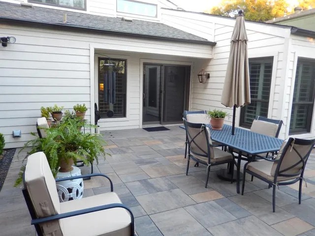 a view of a two chairs in the balcony