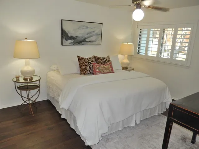 a bedroom with a bed and a lamp