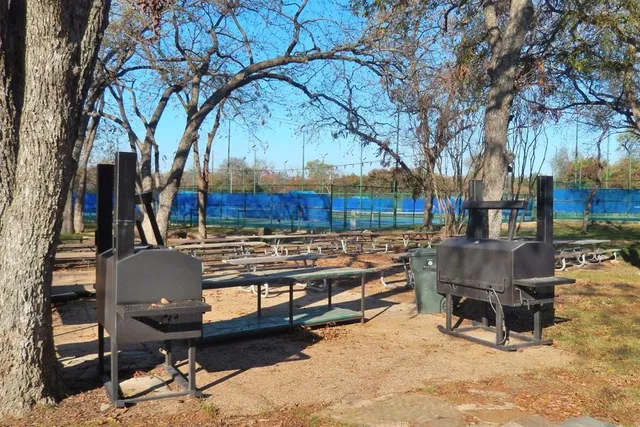 a view of a chairs and tables in the back yard of the house