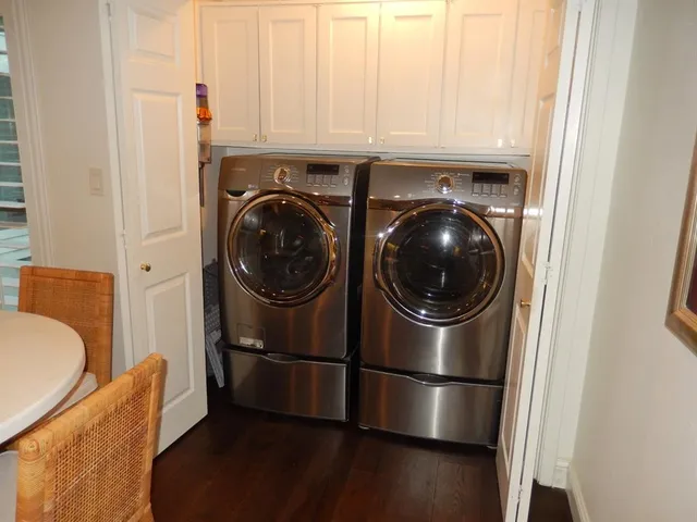 a kitchen with a washer and dryer