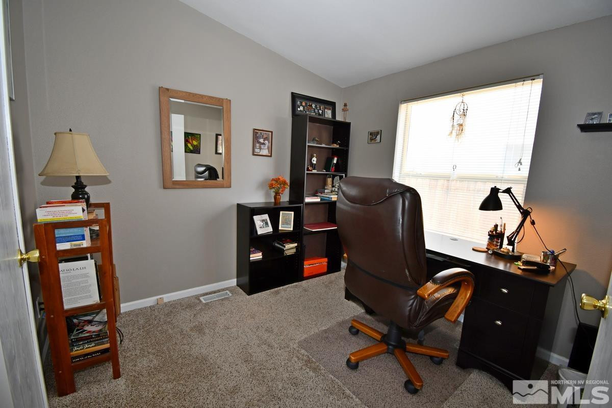 229 Mark Street Gardnerville, NV 89410 - Photo 16 of 24 a view of a workspace with furniture and a window