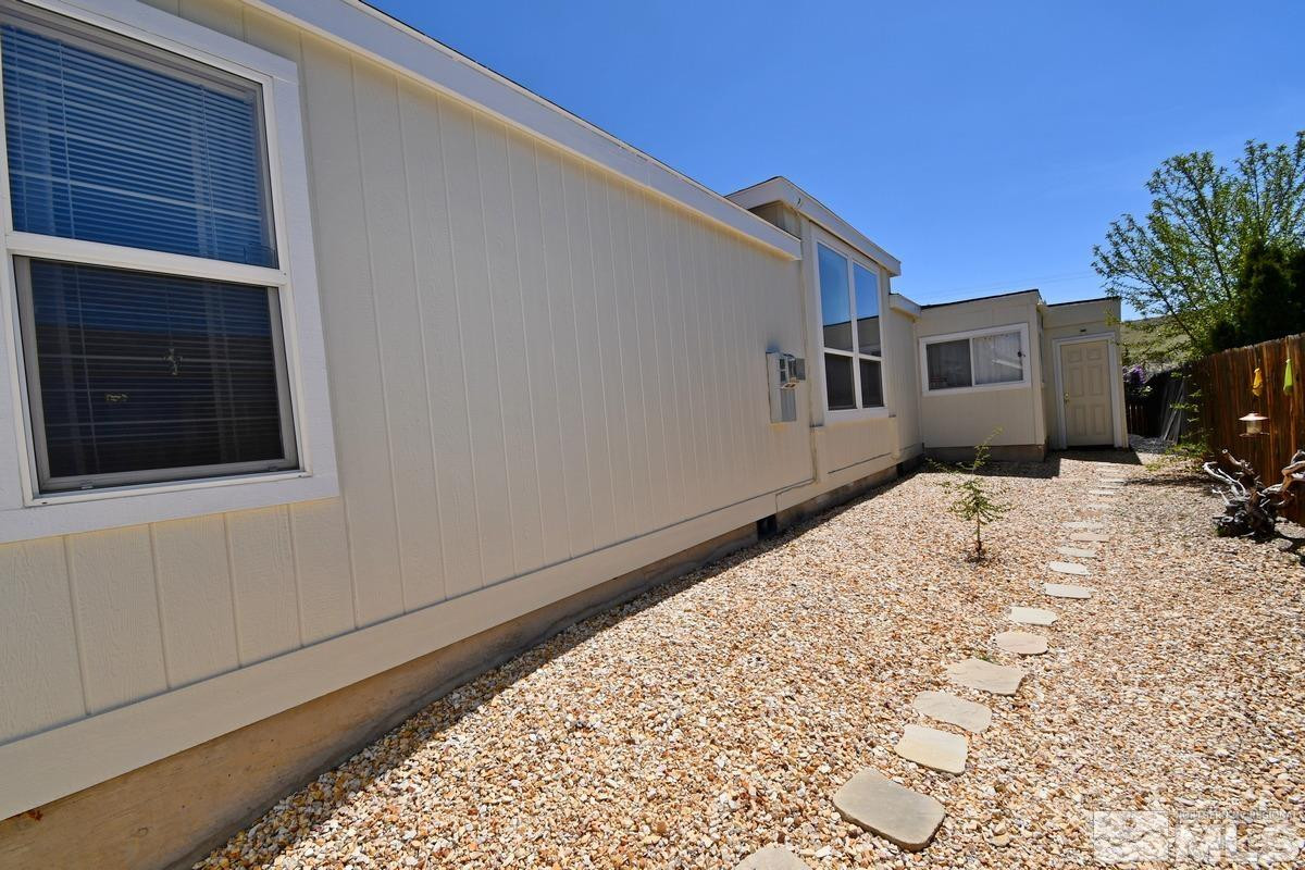 229 Mark Street Gardnerville, NV 89410 - Photo 22 of 24 a bed room with a bed