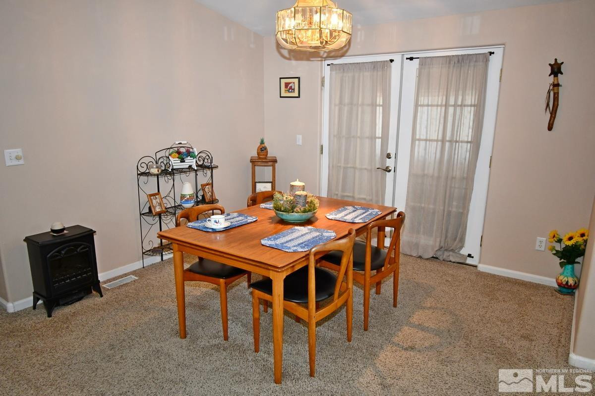 229 Mark Street Gardnerville, NV 89410 - Photo 7 of 24 a dining room with furniture and window