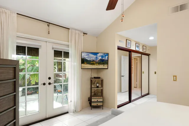 a view of a hallway with windows and entryway