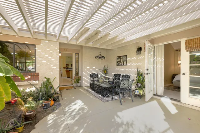 a living room with furniture and flowers