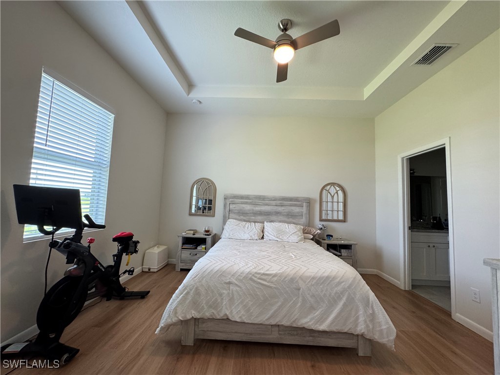 1818 Inwood Road LaBelle, FL 33935 - Photo 15 of 28 a bedroom with a bed gym equipment and a window