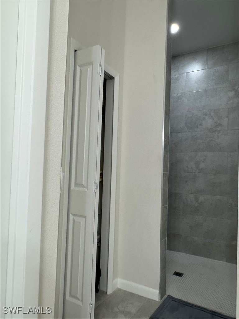 1818 Inwood Road LaBelle, FL 33935 - Photo 18 of 28 a bathroom with a shower and a sink