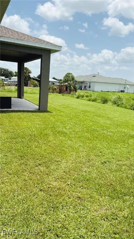 a view of a swimming pool and an outdoor seating