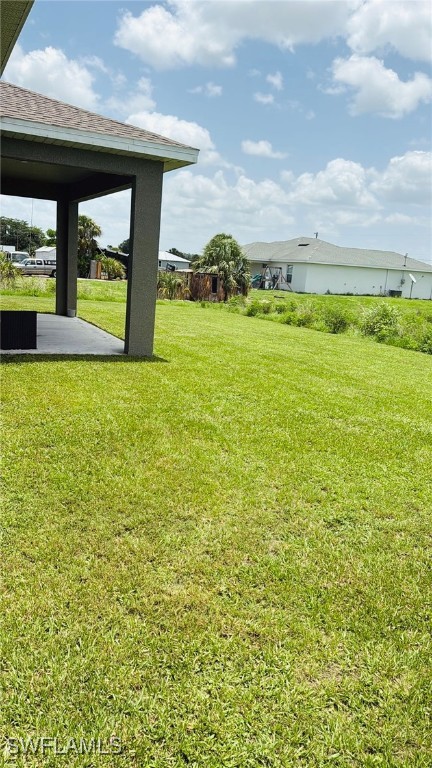 1818 Inwood Road LaBelle, FL 33935 - Photo 22 of 28 a view of a swimming pool and an outdoor seating