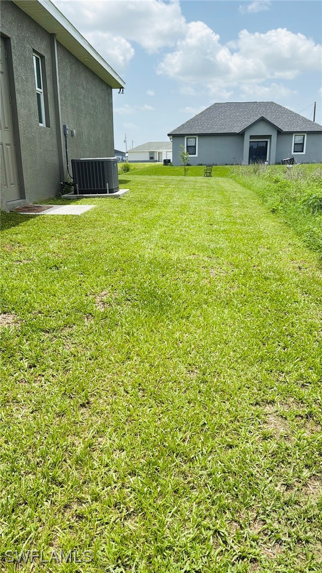 1818 Inwood Road LaBelle, FL 33935 - Photo 24 of 28 a front view of house with yard