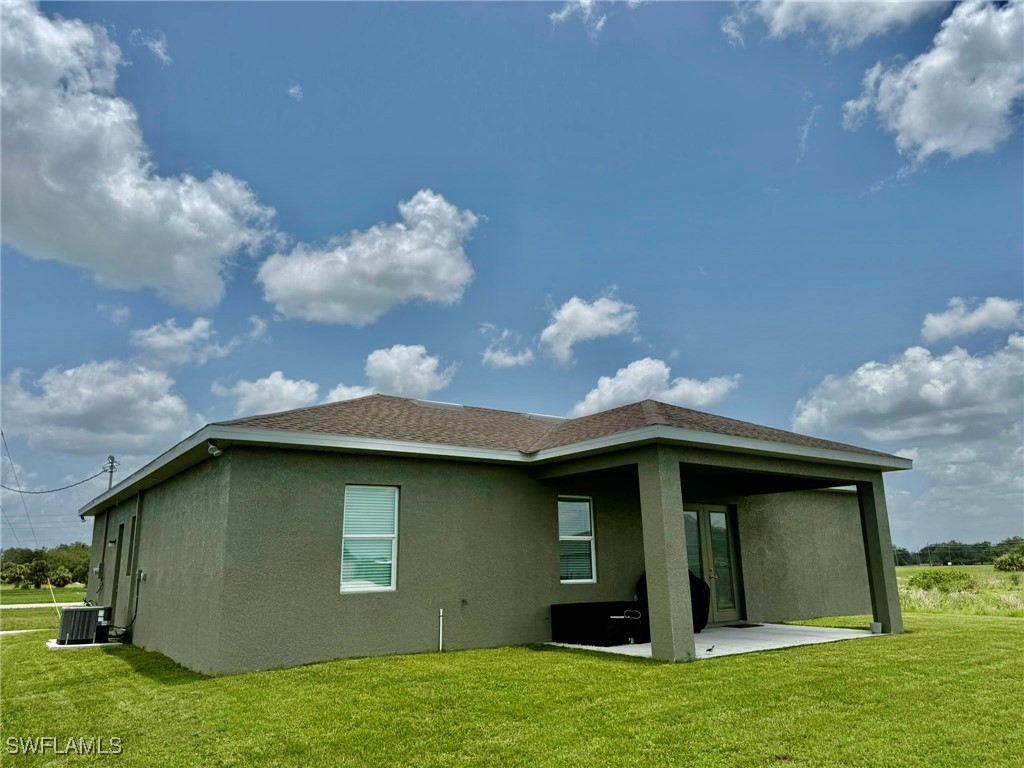 1818 Inwood Road LaBelle, FL 33935 - Photo 25 of 28 a front view of a house with garden