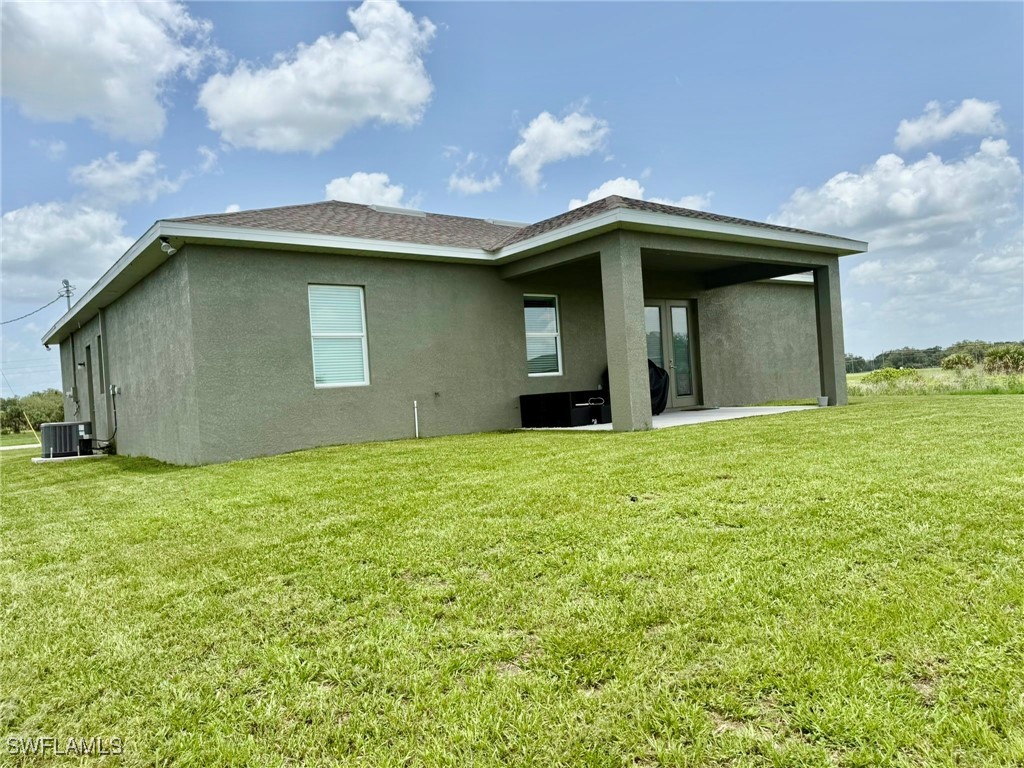 1818 Inwood Road LaBelle, FL 33935 - Photo 26 of 28 a house view with a garden space