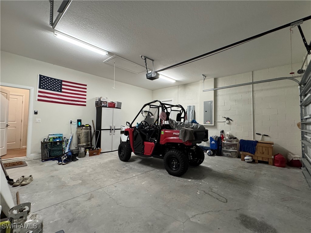 1818 Inwood Road LaBelle, FL 33935 - Photo 27 of 28 a view of car parked in garage