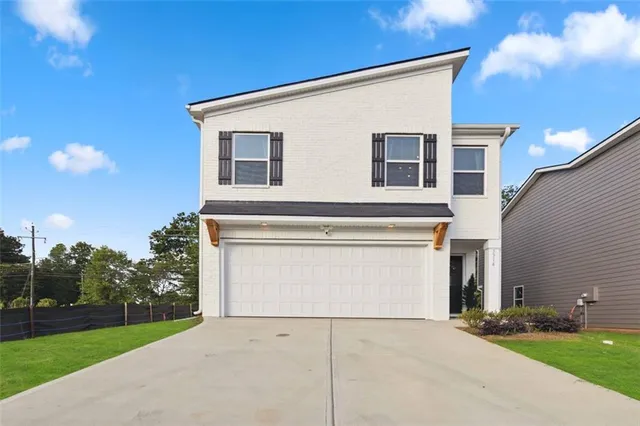 a view of garage and yard