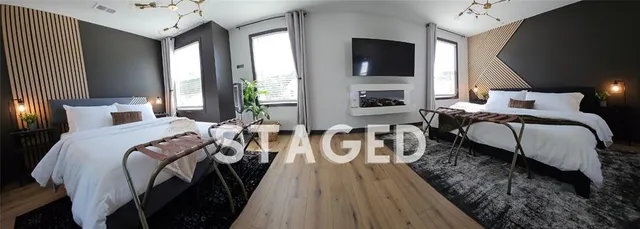 a bedroom with furniture and a fireplace