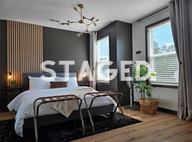 a bedroom with furniture and a window