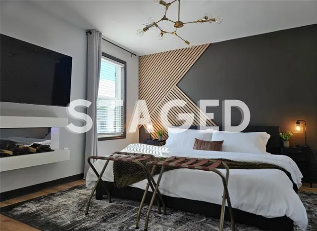 a bedroom with furniture and a window