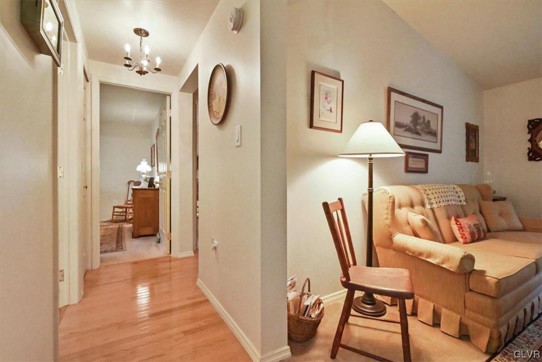 18 Abbey Road Easton, PA 18040 - Photo 17 of 30 a bedroom with furniture and a chandelier