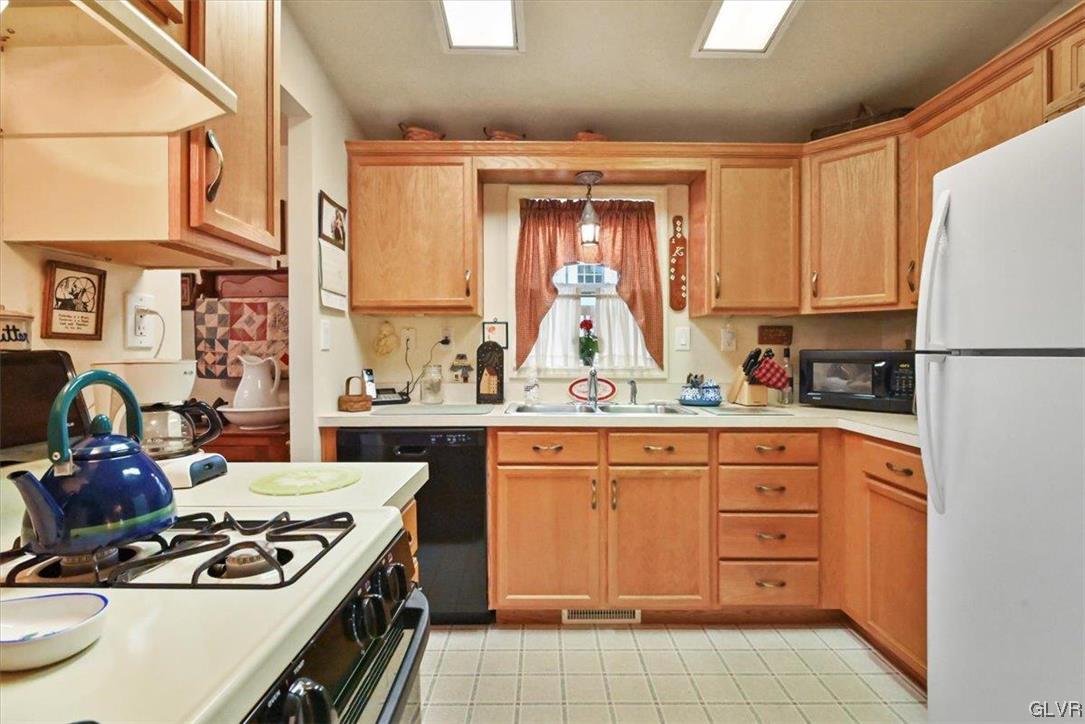 18 Abbey Road Easton, PA 18040 - Photo 8 of 30 a kitchen with a stove a sink and a refrigerator