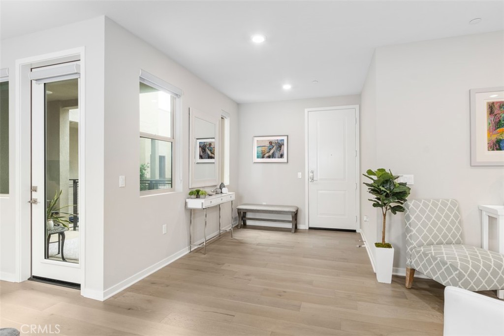 135 Bowery Irvine, CA 92612 - Photo 11 of 31 an empty room with windows and entryway