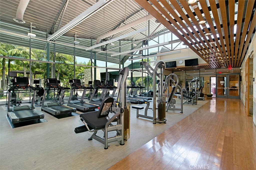 135 Bowery Irvine, CA 92612 - Photo 23 of 31 a view of a patio with table and chairs potted plants and large tree