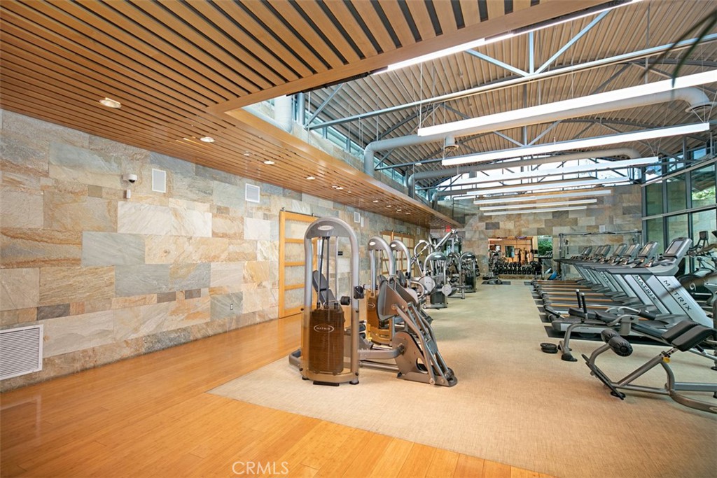 135 Bowery Irvine, CA 92612 - Photo 24 of 31 a view of a room with gym equipment