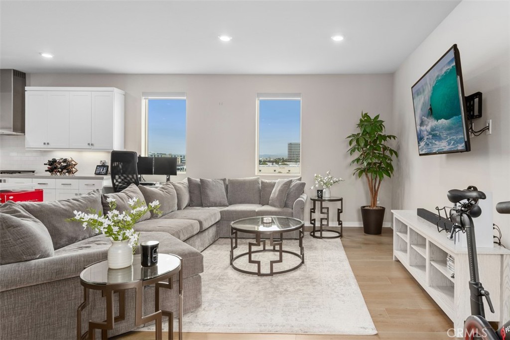 135 Bowery Irvine, CA 92612 - Photo 4 of 31 a living room with furniture and a flat screen tv