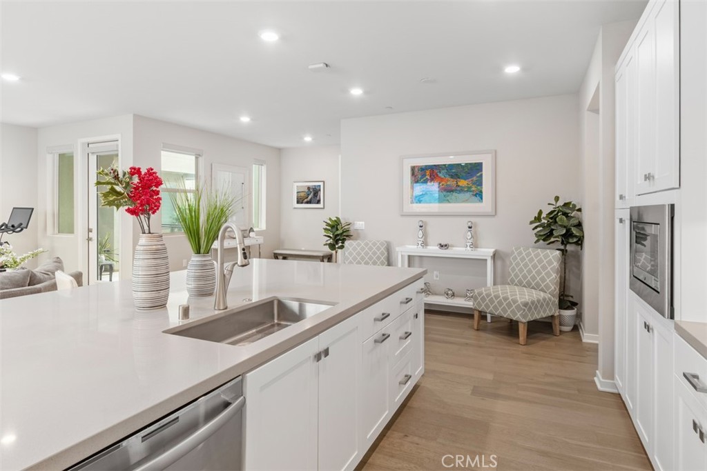 135 Bowery Irvine, CA 92612 - Photo 7 of 31 a living room with furniture and flowers