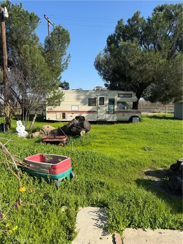 a swimming pool with outdoor seating and yard