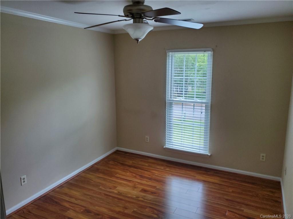 12820 Danby Road Indian Land, SC 29707 - Photo 12 of 21 wooden floor in an empty room with a window