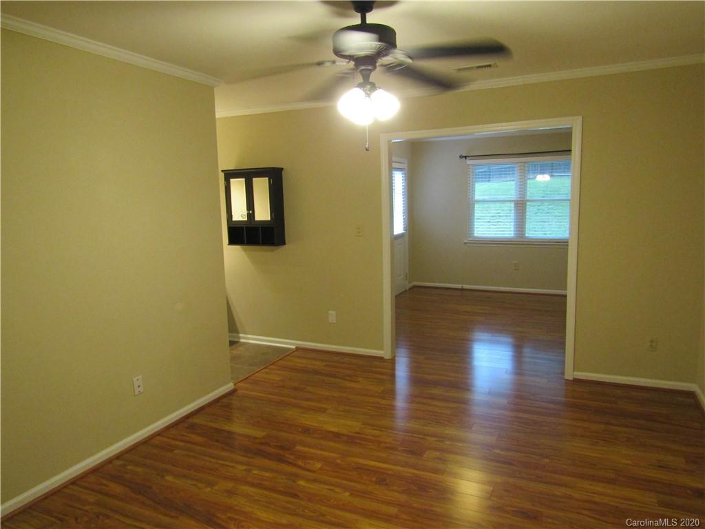 12820 Danby Road Indian Land, SC 29707 - Photo 13 of 21 a view of empty room with wooden floor and fan