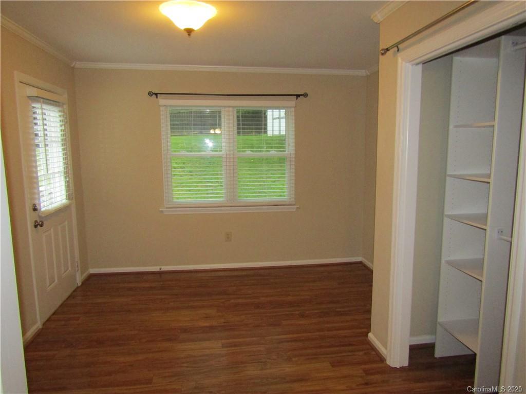 12820 Danby Road Indian Land, SC 29707 - Photo 17 of 21 a view of an empty room with wooden floor and a window