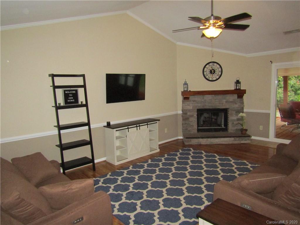 12820 Danby Road Indian Land, SC 29707 - Photo 3 of 21 a living room with a couch and a fireplace