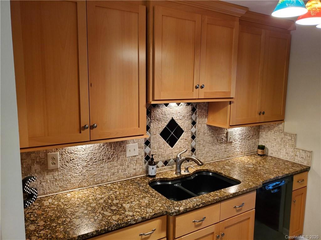 12820 Danby Road Indian Land, SC 29707 - Photo 6 of 21 a kitchen with granite countertop a sink and cabinets