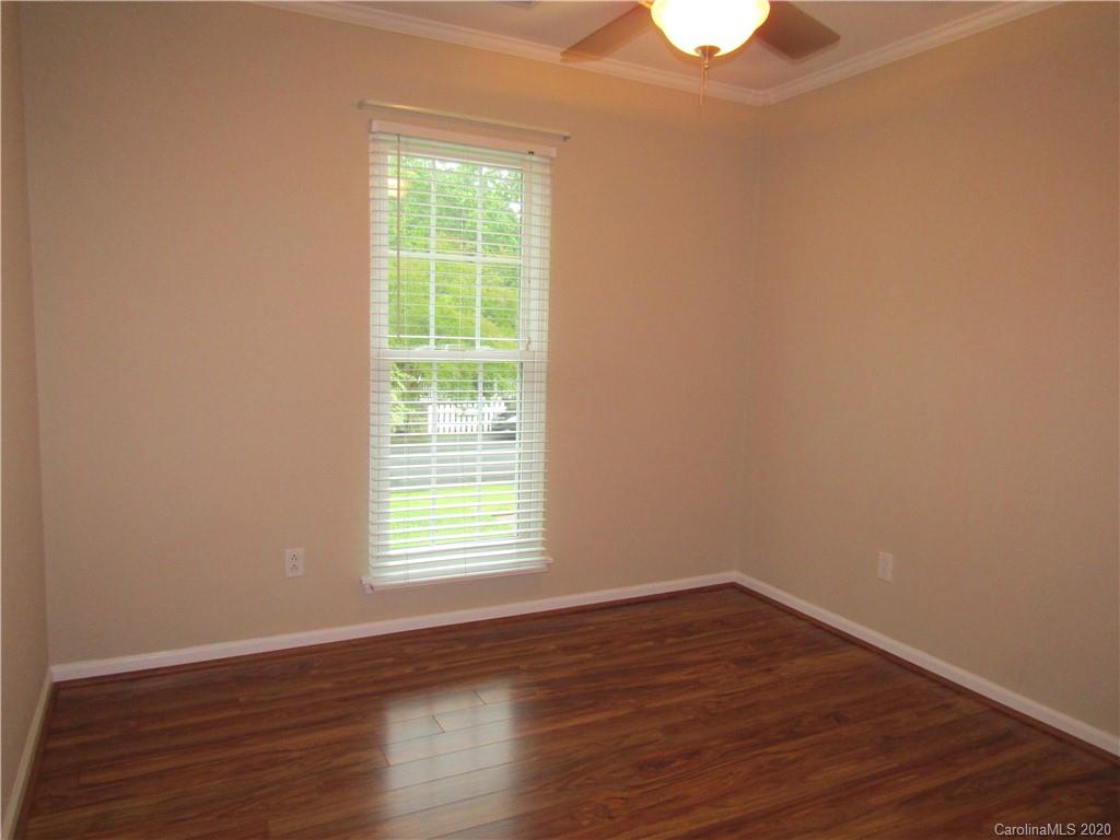 12820 Danby Road Indian Land, SC 29707 - Photo 10 of 21 a view of an empty room with wooden floor and a window