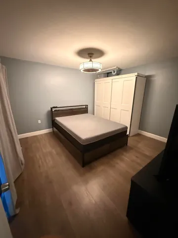 a room with pool table and windows