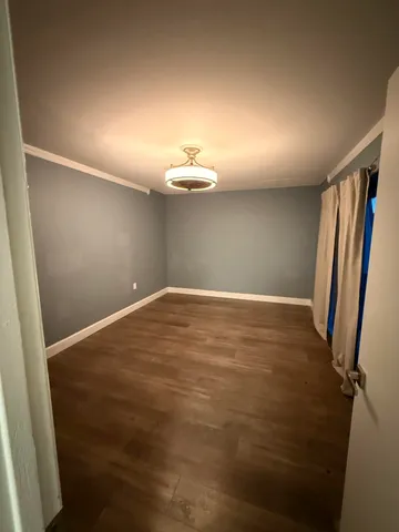 an empty room with a mirror