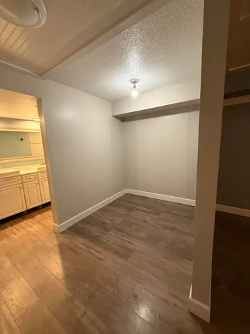 a view of an empty room with a window