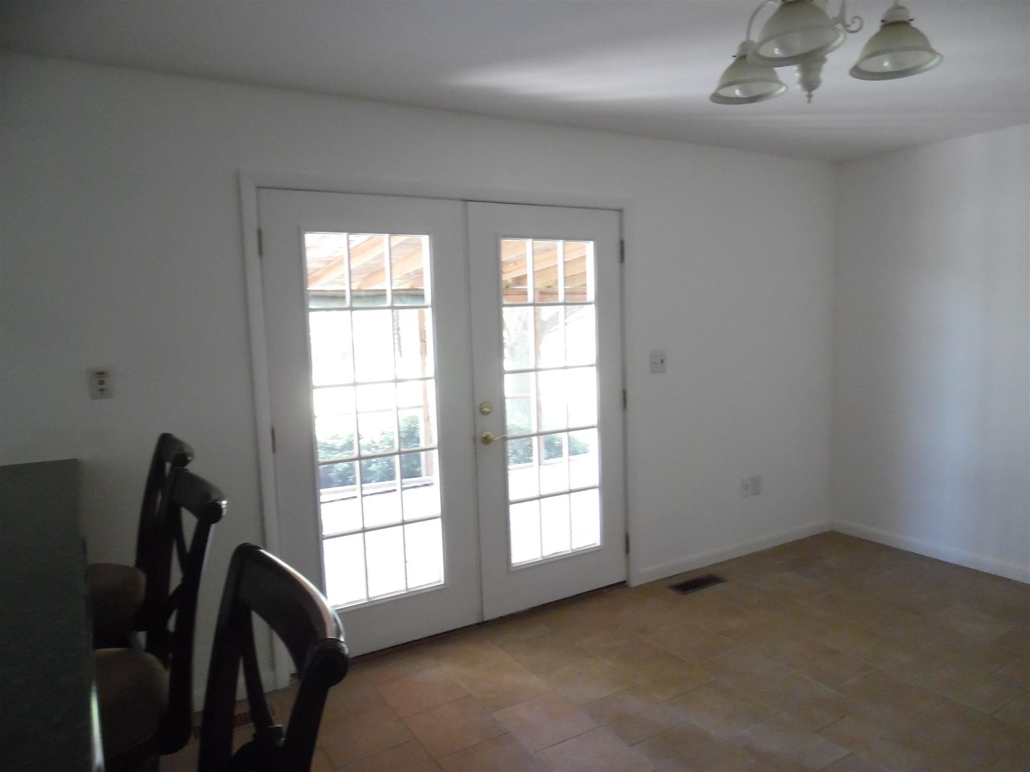 1004 Springer Road Lawrenceburg, TN 38464 - Photo 17 of 20 FRENCH DOORS GOING OUT TO COVERED PORCH