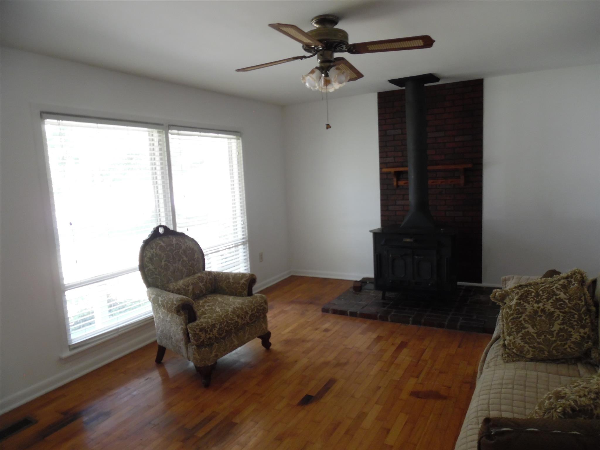 1004 Springer Road Lawrenceburg, TN 38464 - Photo 3 of 20 LIVING RM W/CENTRAL & A WOOD HEATER