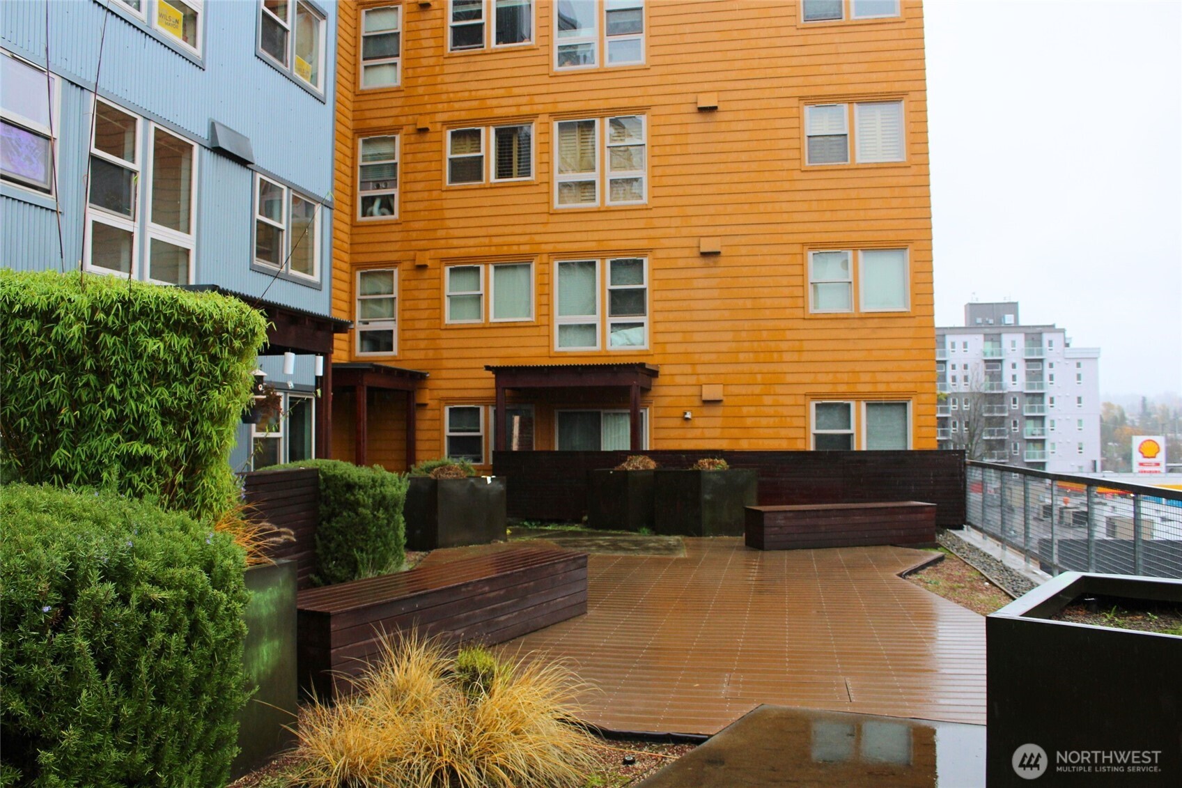 827 Hiawatha Place South, Unit 406 Seattle, WA 98144 - Photo 12 of 13 a view of a building with many windows and plants