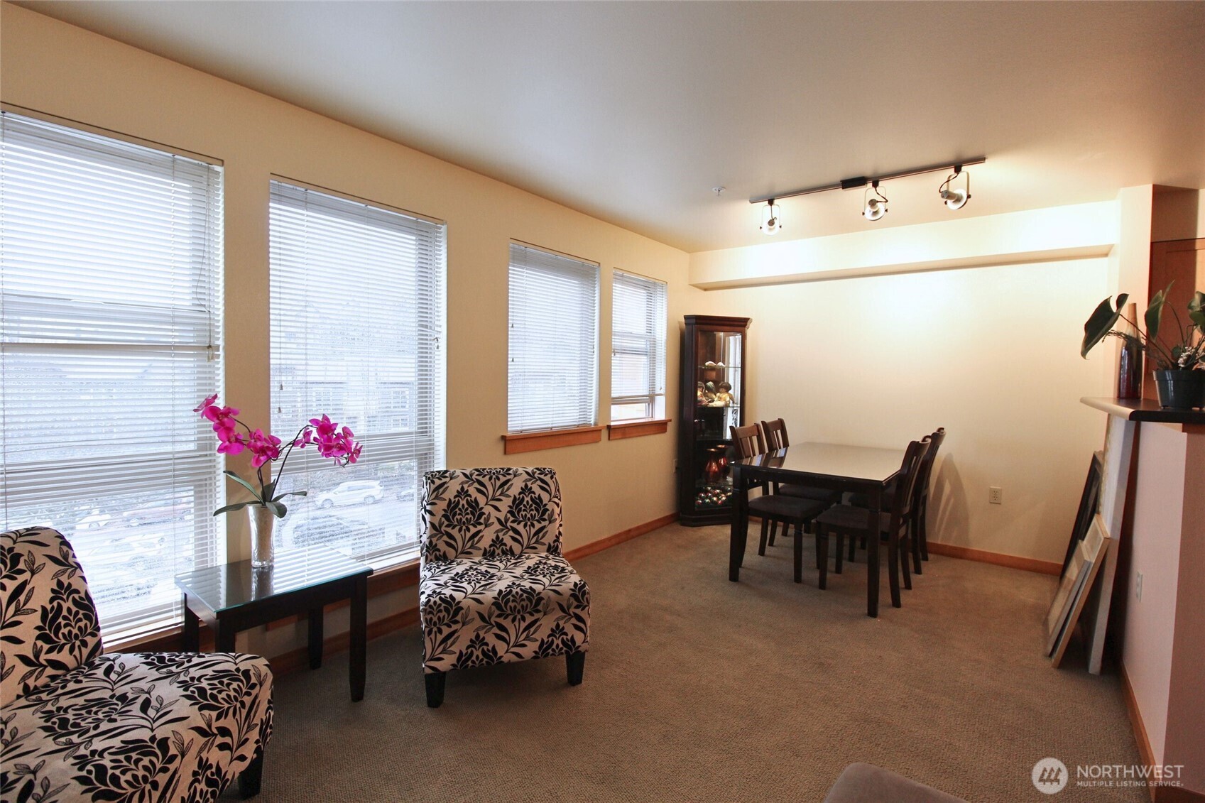 827 Hiawatha Place South, Unit 406 Seattle, WA 98144 - Photo 2 of 13 a bedroom with furniture and a window