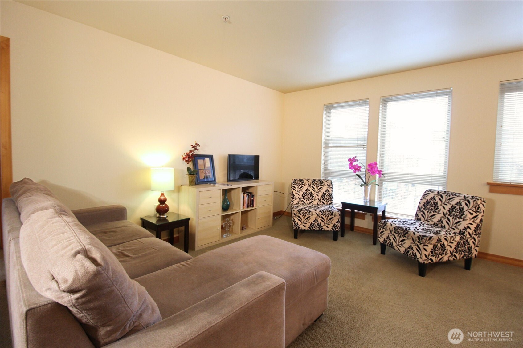 827 Hiawatha Place South, Unit 406 Seattle, WA 98144 - Photo 3 of 13 a bedroom with furniture and a large window