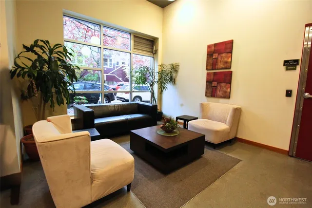 a living room with furniture and a large window