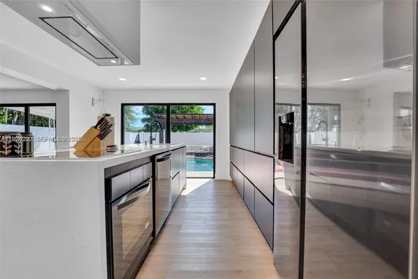 a view of a hallway view with wooden floor and staircase