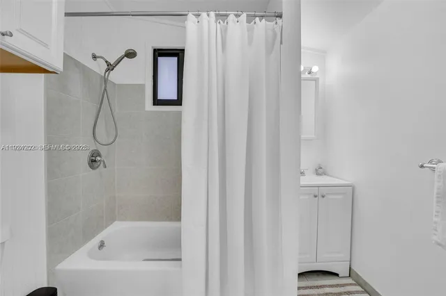 a bathroom with a bath tub