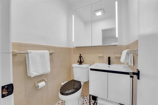 a kitchen with a sink a stove a refrigerator and a stove