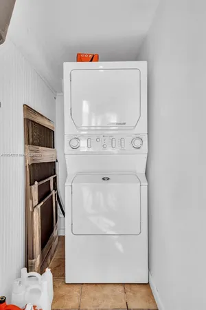 a utility room with washer and dryer