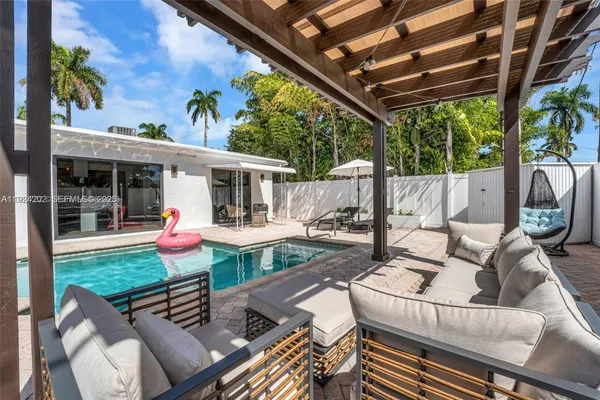 a view of an outdoor sitting area with furniture