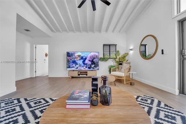 a living room with furniture and a rug